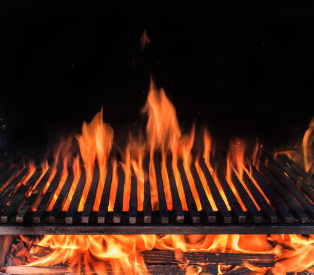 istock Empty grill grate and tongues of fire flame. 1128075350