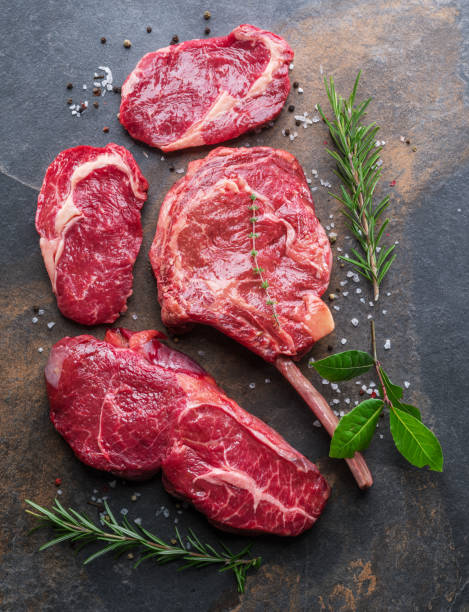 istock Raw  Rib eye steak or beef steak with herbs and spices. 1128075737