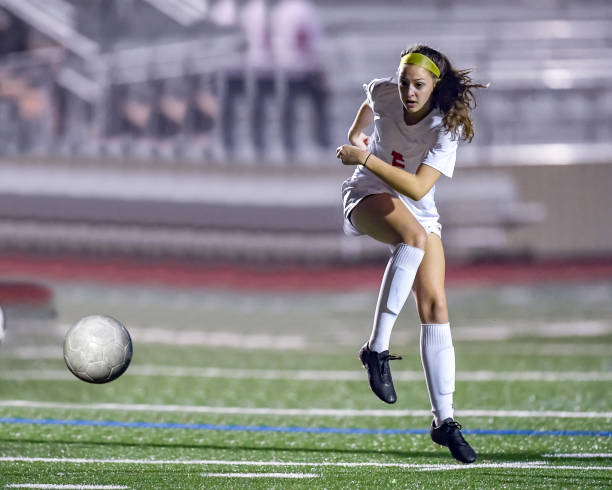 istock Young girl practicing her soccer skills 1128077953