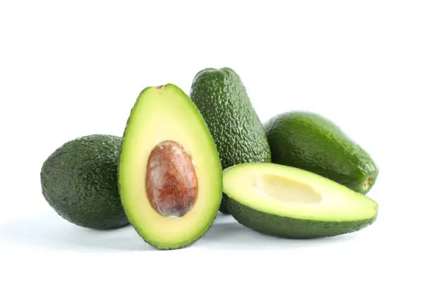 Ripe sliced avocado on white background