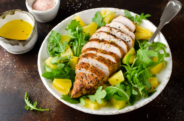 grilled chicken breast with pineapple and arugula - chicken breast chicken grilled chicken protein imagens e fotografias de stock
