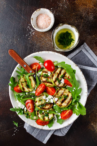 istock Grilled zucchini with arugula, tomatoes and cottage cheese 1128080126