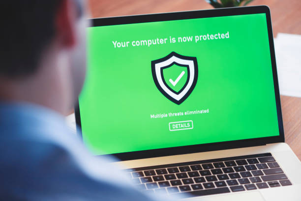 istock Businessman looking at a antivirus security log in screen on a computer. 1128082126
