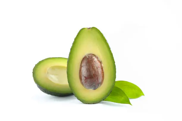 Ripe sliced avocado on white background