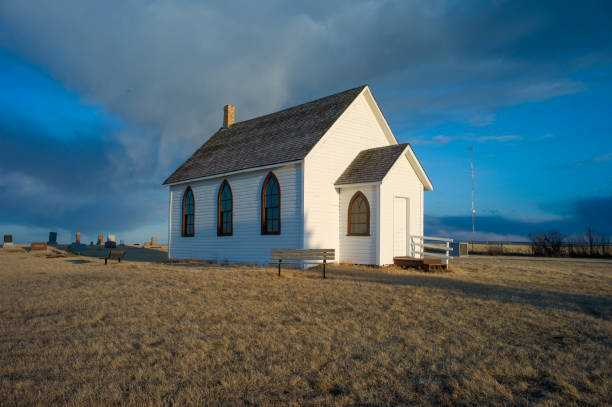 istock Small Vintage Prairie Church sit on a Hill Top, Alberta, Canada 1128084318