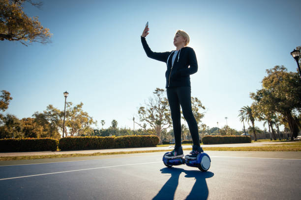 Mixed race kids - Latin teenager on the self balancing board Exercising for healthy lifestyle in USA. Teenager is mix of Colombian and Caucasian parents hoverboard stock pictures, royalty-free photos & images