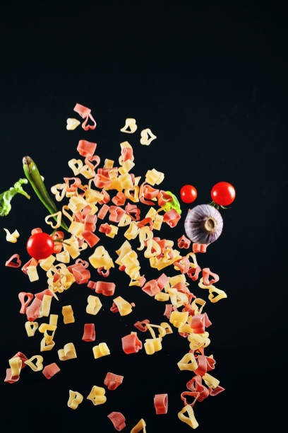istock Heart Shaped Macaroni Pasta Food Explosion 1128085303