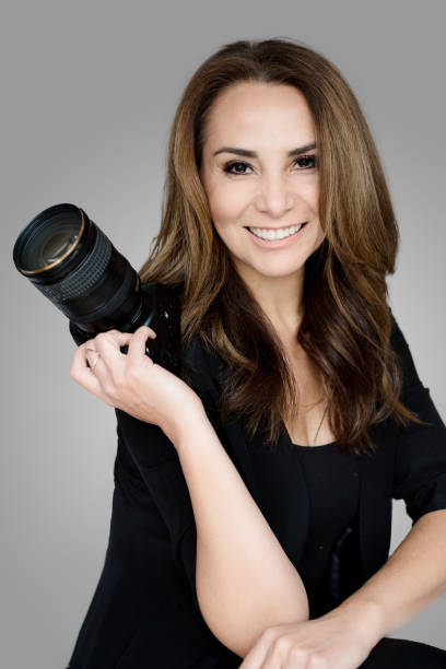 Mature woman photographer with camera