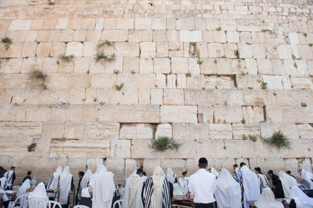 Faith on the Wailing Wall of Jerusalem April 17, 2018 - Jerusalem, Israel: People, tourists and jews from all over the world pay their penitence and  pray in front of the Western Wall. wailing wall stock pictures, royalty-free photos & images