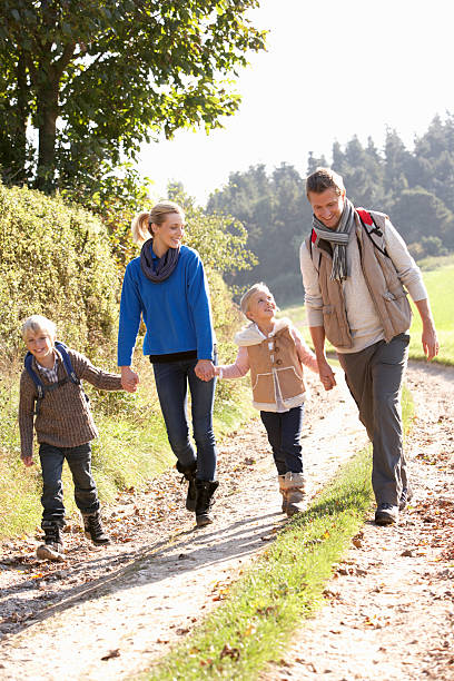 istock Young family walking in park 112808696