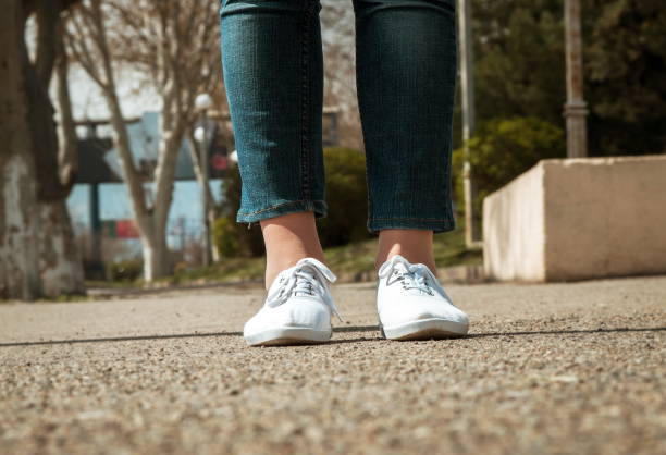 istock Low Section Of Woman Standing On Road 1128090003