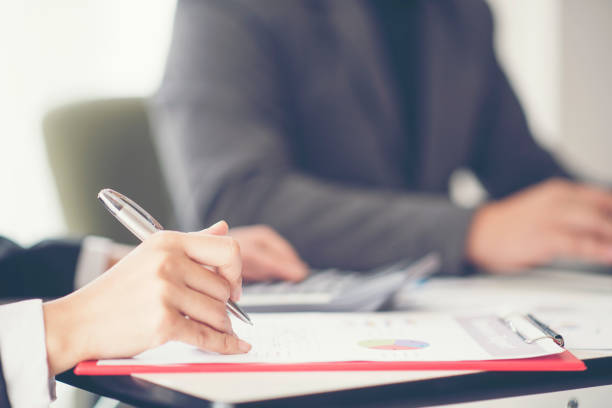 istock Business People Working At Table In Office 1128092195