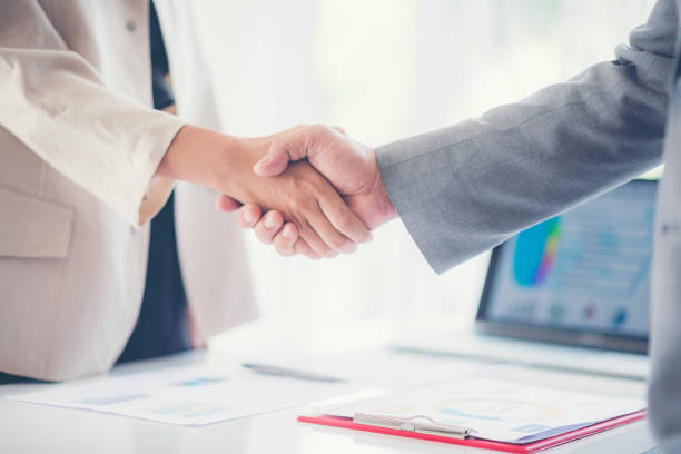 istock Close-Up Of Business People Shaking Hands 1128092302
