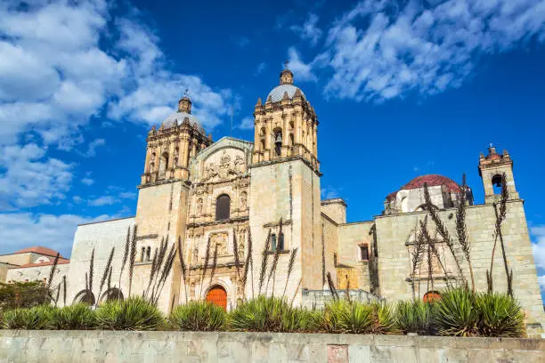Beautiful Santo Domingo church and agave plants in Oaxaca, Mexico
