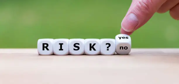 Take a risk? Hand turns a dice and changes the word "no" to "yes" (or vice versa).