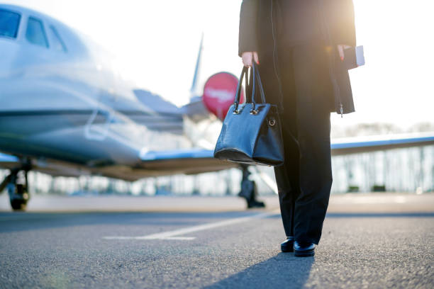 istock Young businesswoman leaving private jet airplane 1128096862