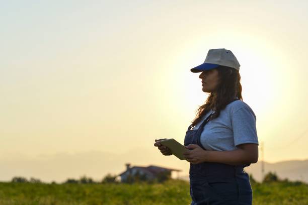 istock Young female farmer with digital tablet 1128097032