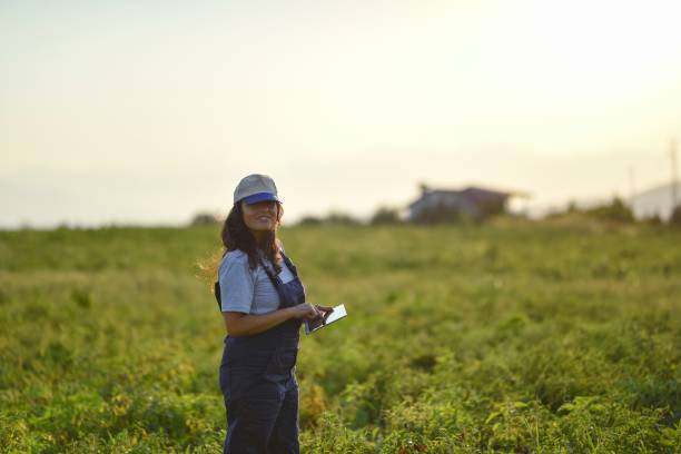 istock Young female farmer with digital tablet 1128099569