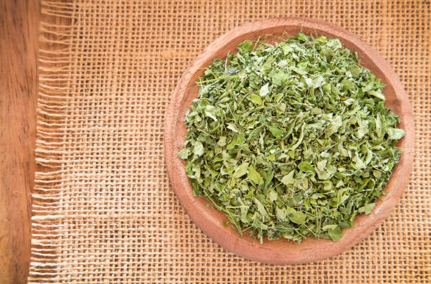 Organic moringa leaves - Moringa oleifera Organic moringa leaves - Moringa oleifera drumstick stock pictures, royalty-free photos & images