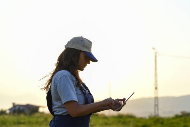 istock Young female farmer with digital tablet 1128099671