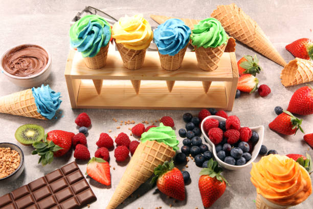 istock Vanilla frozen yogurt or colorful soft ice cream in waffle cone. 1128100632