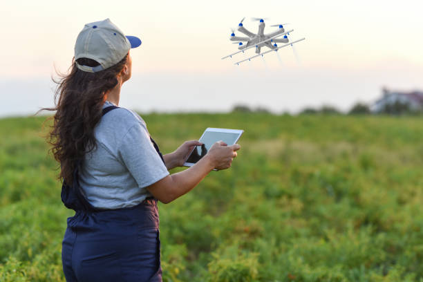 istock Young female farmer spraying her crops using a drone 1128101553