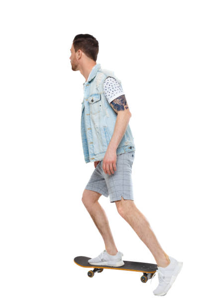 istock Back view of a man with a skateboard. 1128102421