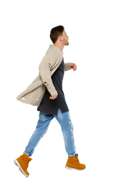 istock Side view of a running man in sweater. 1128103188