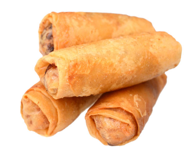 A stacking of Egg rolls pile isolated white stock photo