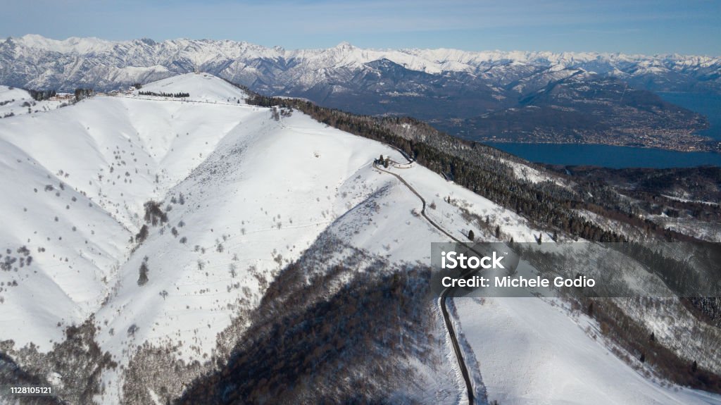 Snow route Road on the top of the mountain, in the middle of the snow. (Mottarone) Beauty In Nature Stock Photo