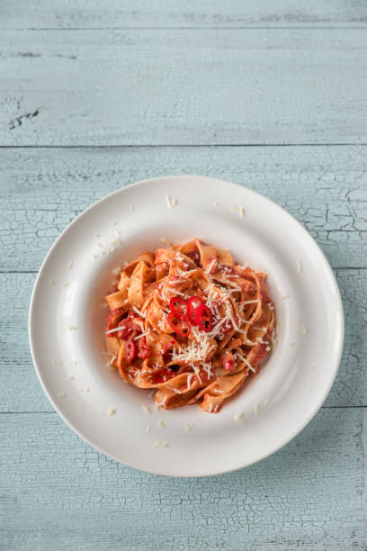 Portion of Amatriciana pasta Portion of tagliatelle pasta with amatriciana sauce all'amatriciana stock pictures, royalty-free photos & images