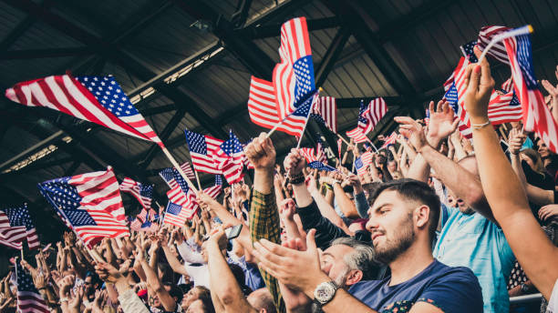 istock US fans cheering for their team 1128114557