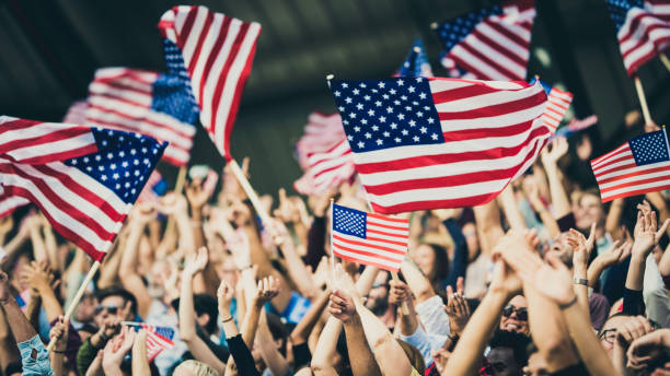 tifosi usa sventolano le loro bandiere - american flag flag usa waving foto e immagini stock