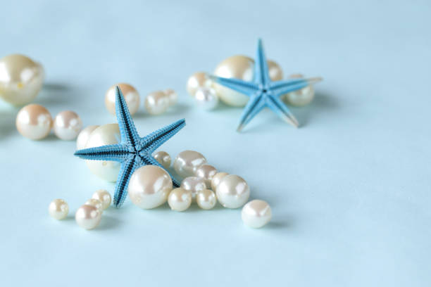 летние изображения (звездная рыба и жемчуг) - pearl shell starfish beach стоковые фото и изображения