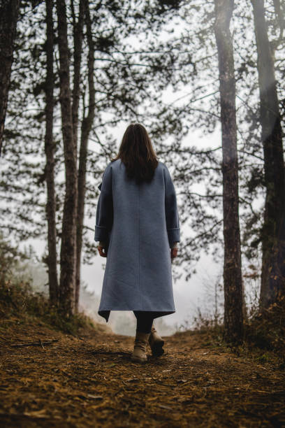 istock Young Woman On The Path In Forest 1128118878