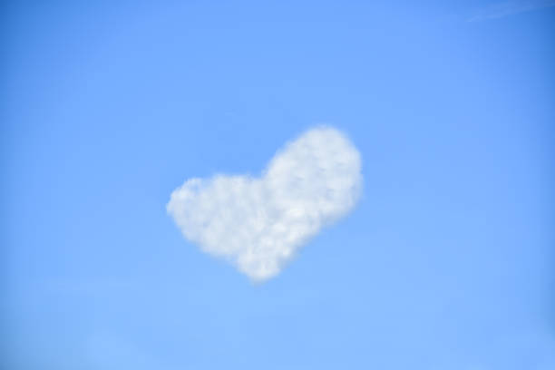 istock white clouds in the shape of heart on a blue sky 1128122021