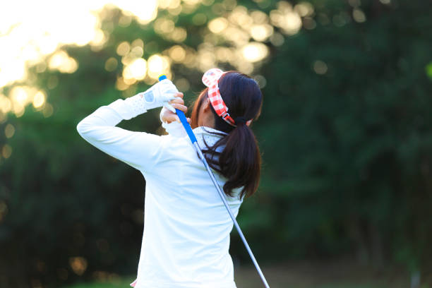 istock Asian woman golf beginner 1128122423