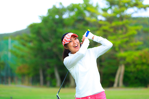 Asian woman golf beginner