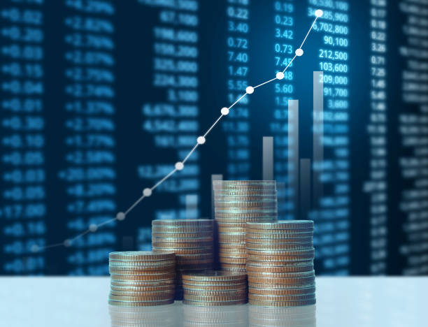 istock Coins graph stock market 1128123951