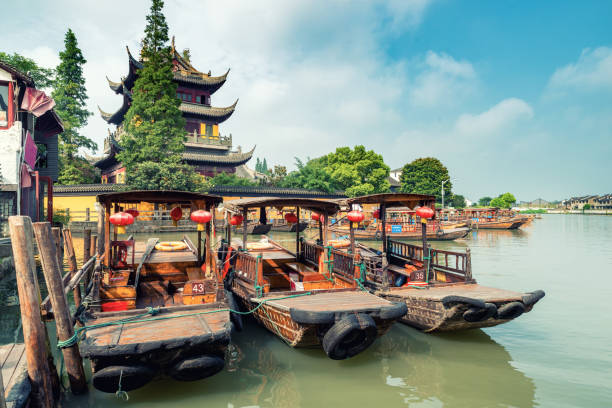 China traditional tourist boats on canals of Shanghai Zhujiajiao Water Town in Shanghai, China China traditional tourist boats on canals of Shanghai Zhujiajiao Water Town in Shanghai, China Zhujiajiao stock pictures, royalty-free photos & images