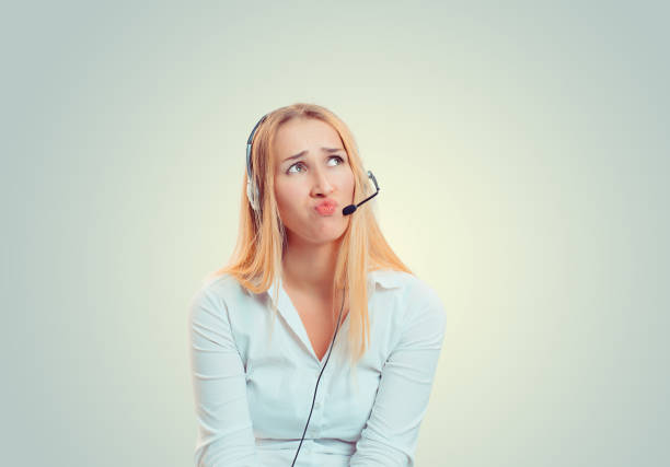 istock Cute girl with headset, annoyed upset sad looking up skeptical 1128131351