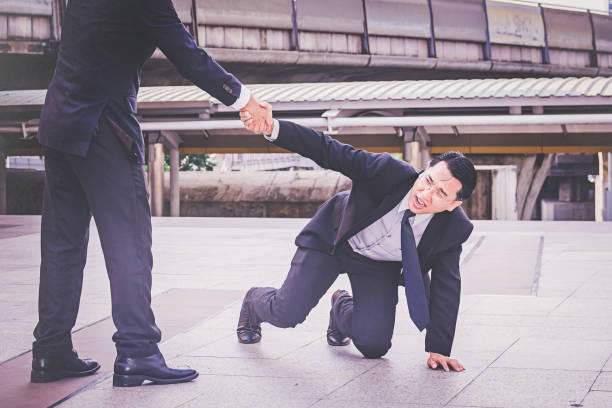 istock businessman Helping hand in business concept 1128132450