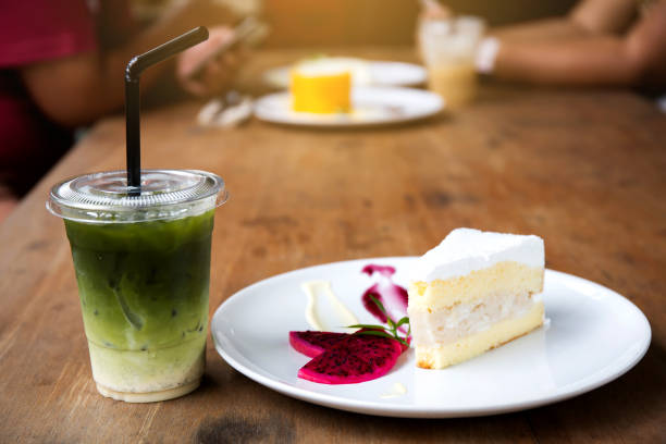 Coconut cake on white plate on table