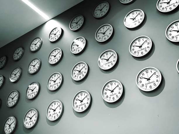 Wall of clocks for world cities and time zones Many clocks on a wall for cities around the world time zone stock pictures, royalty-free photos & images