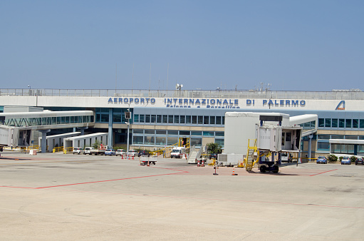 Palermo, Italy - June 21, 2018: View of the terminal building at Palermo's international airport, named after the anti-mafia duo Falcone e Borsellino.  Sunny summer morning.