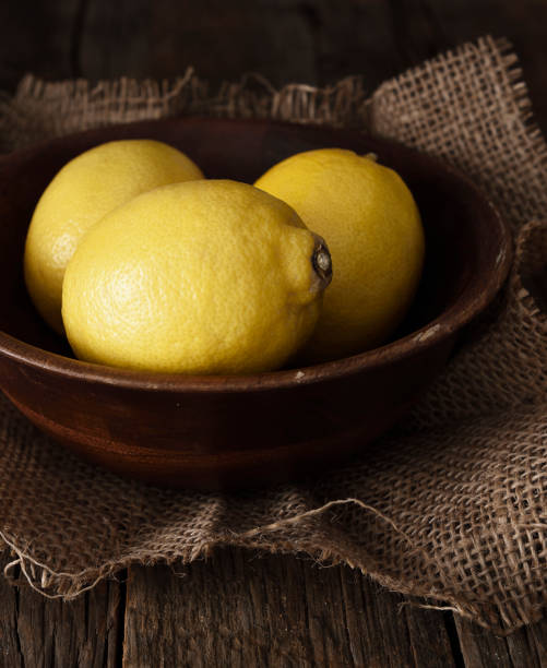 istock Lemons on a wooden background 1128137430