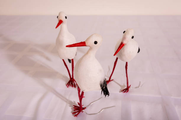 Decorative figures of a stork Decorative figurines of a stork for decorating a bouquet or table for a holiday кукла stock pictures, royalty-free photos & images