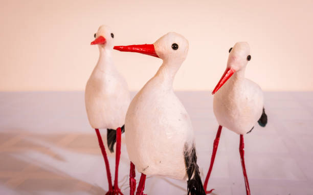 Decorative figures of a stork Decorative figurines of a stork for decorating a bouquet or table for a holiday кукла stock pictures, royalty-free photos & images