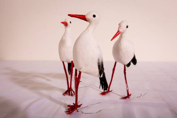 Decorative figures of a stork Decorative figurines of a stork for decorating a bouquet or table for a holiday кукла stock pictures, royalty-free photos & images
