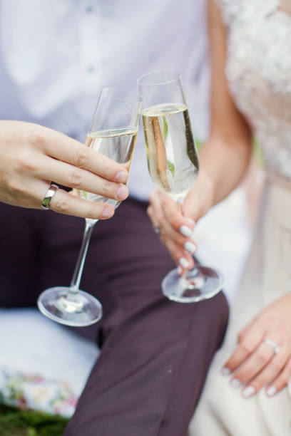 istock couple holding glasses with champagne 1128150637